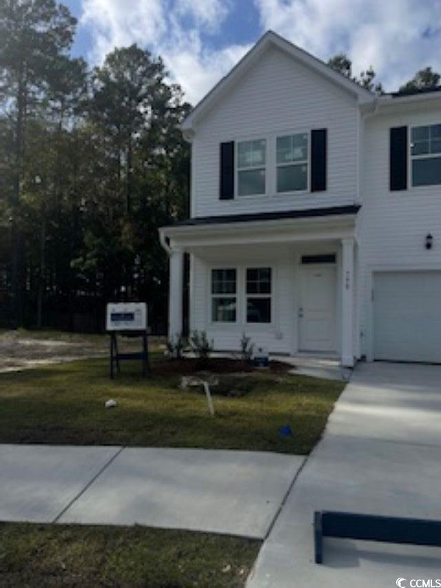 View of front of house featuring a garage and a fr