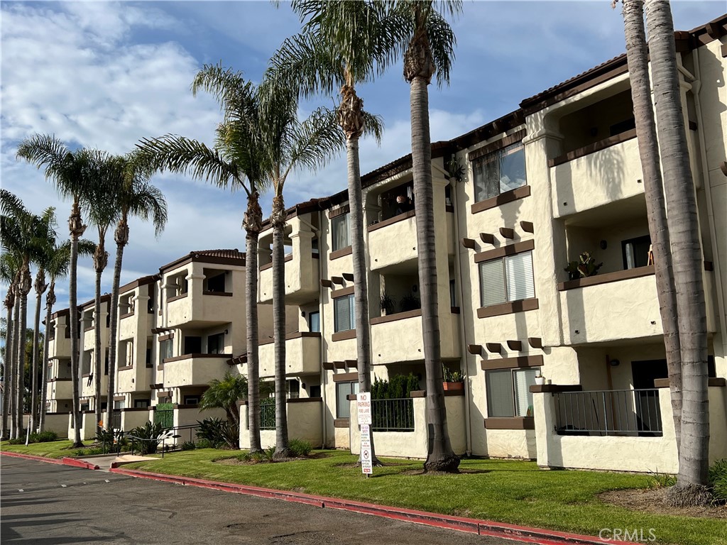 a view of a building with a yard