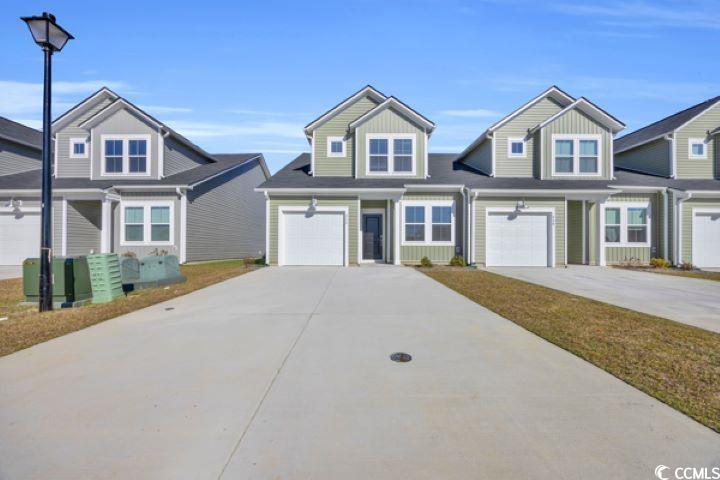 View of front of home with a garage