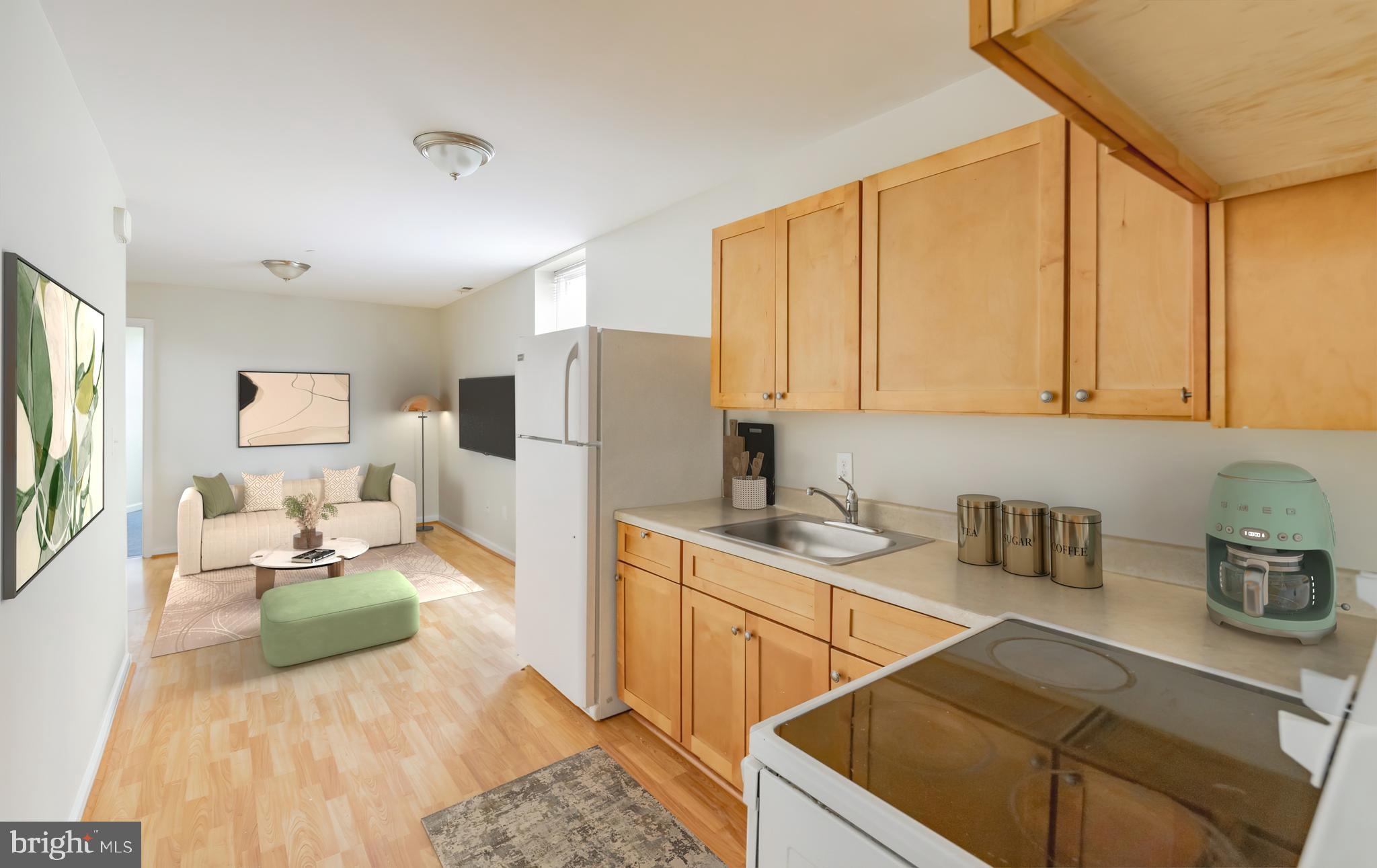 a kitchen with refrigerator and cabinets