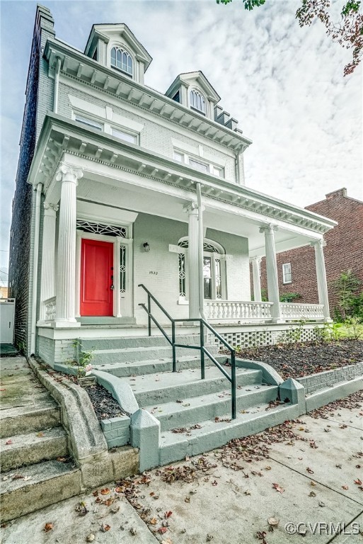 View of front of property featuring covered porch