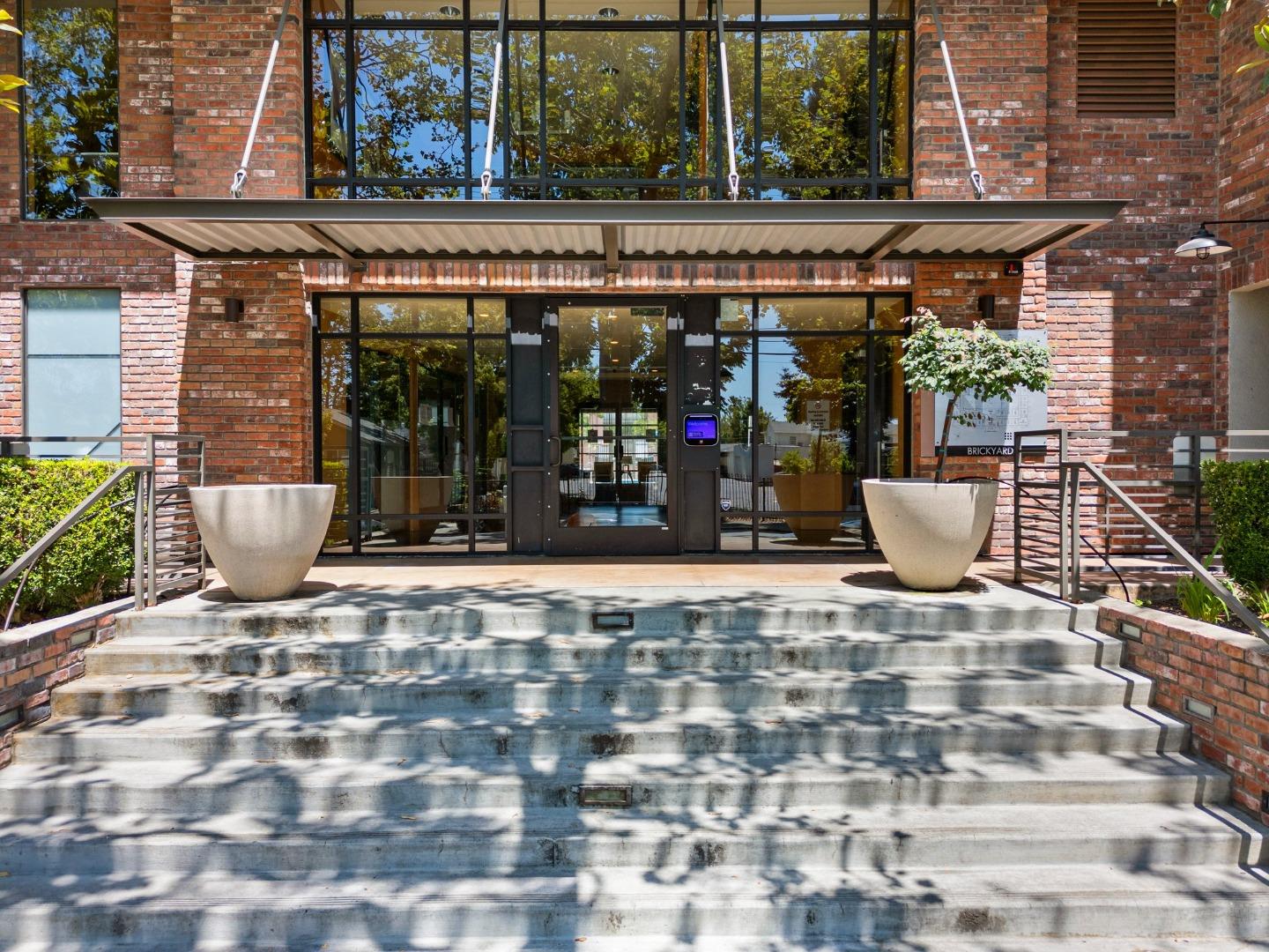 a view of a building with sitting area