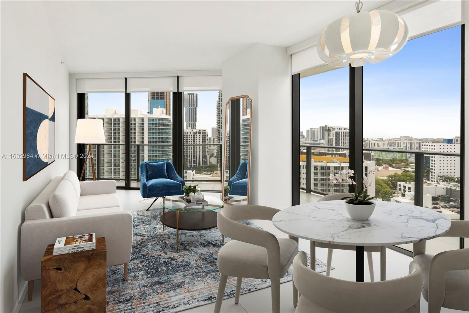 a living room with furniture and a floor to ceiling window