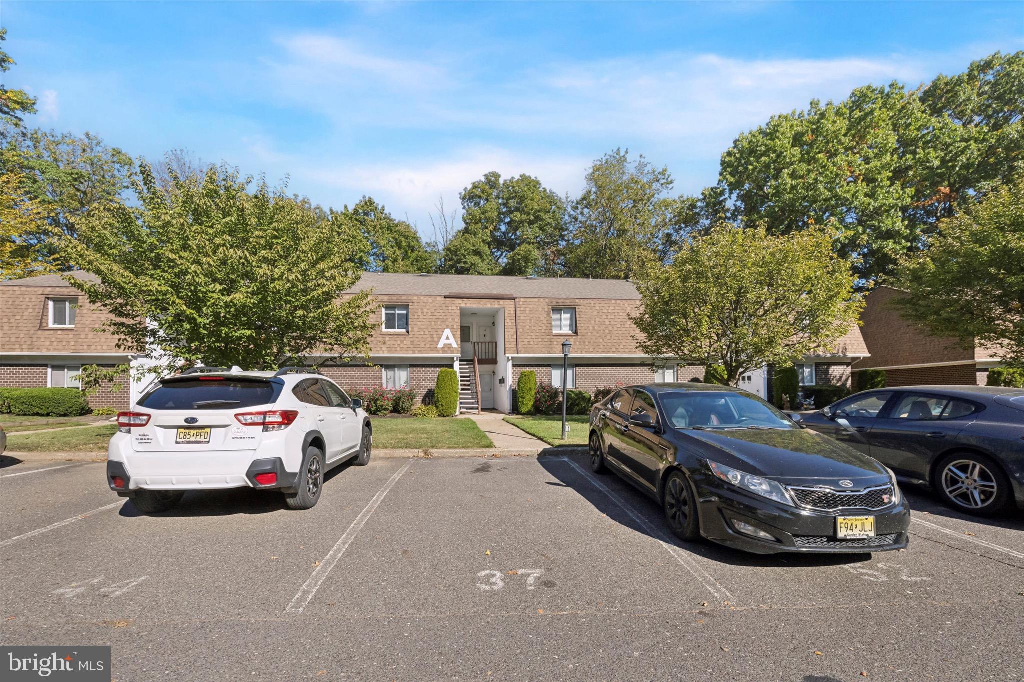 a view of a car parked in front of a house