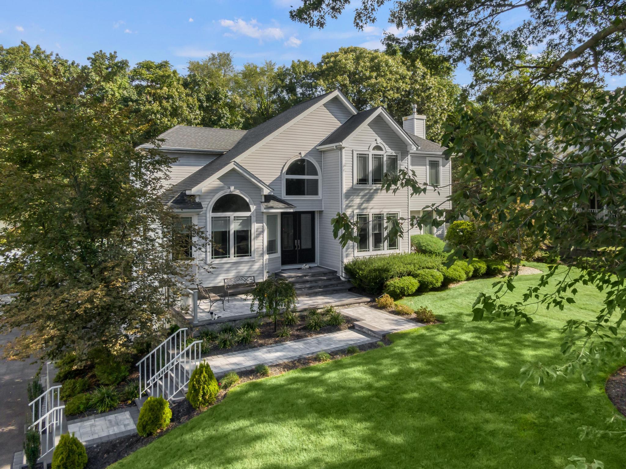 a front view of a house with a yard