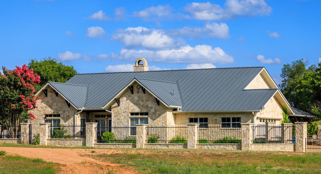 a view of house with outdoor space and sitting area