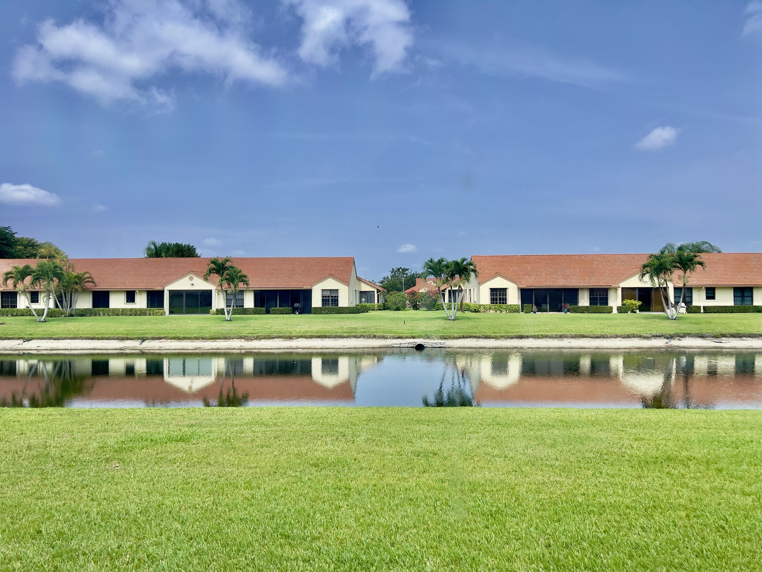 a front view of a house with a lake view