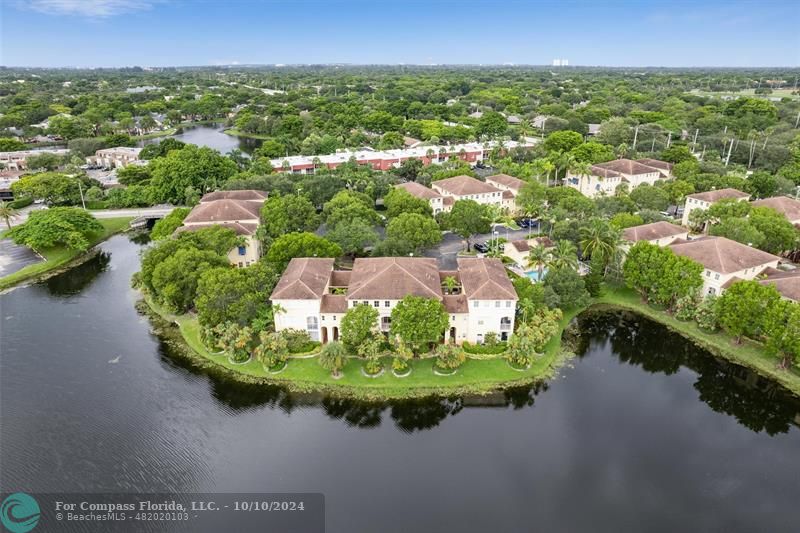 an aerial view of a house with a lake view