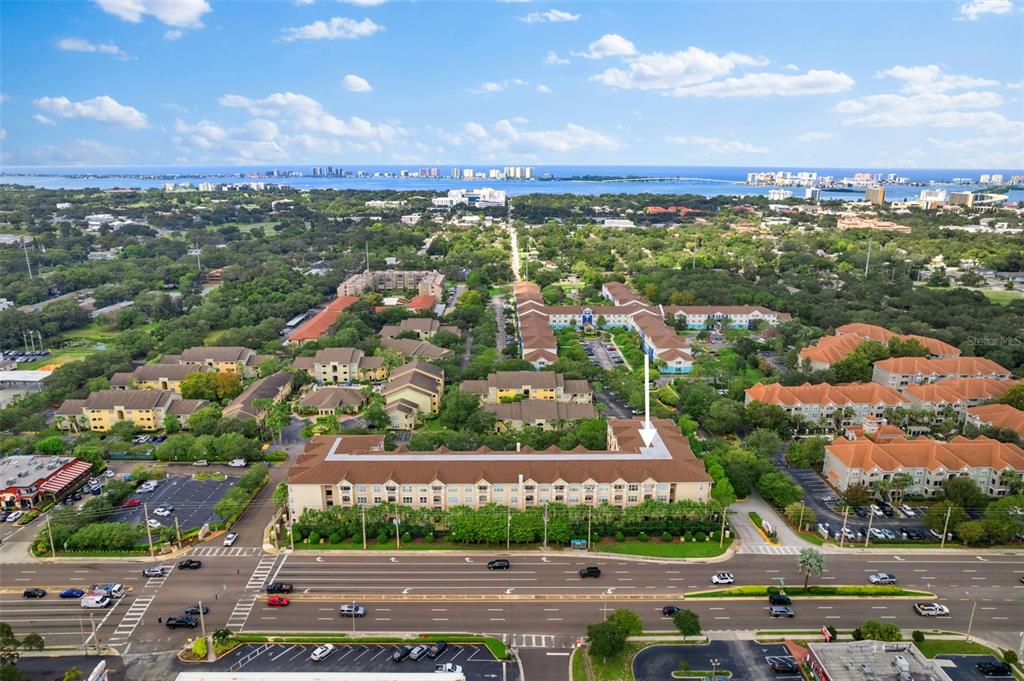 an aerial view of residential building and lake