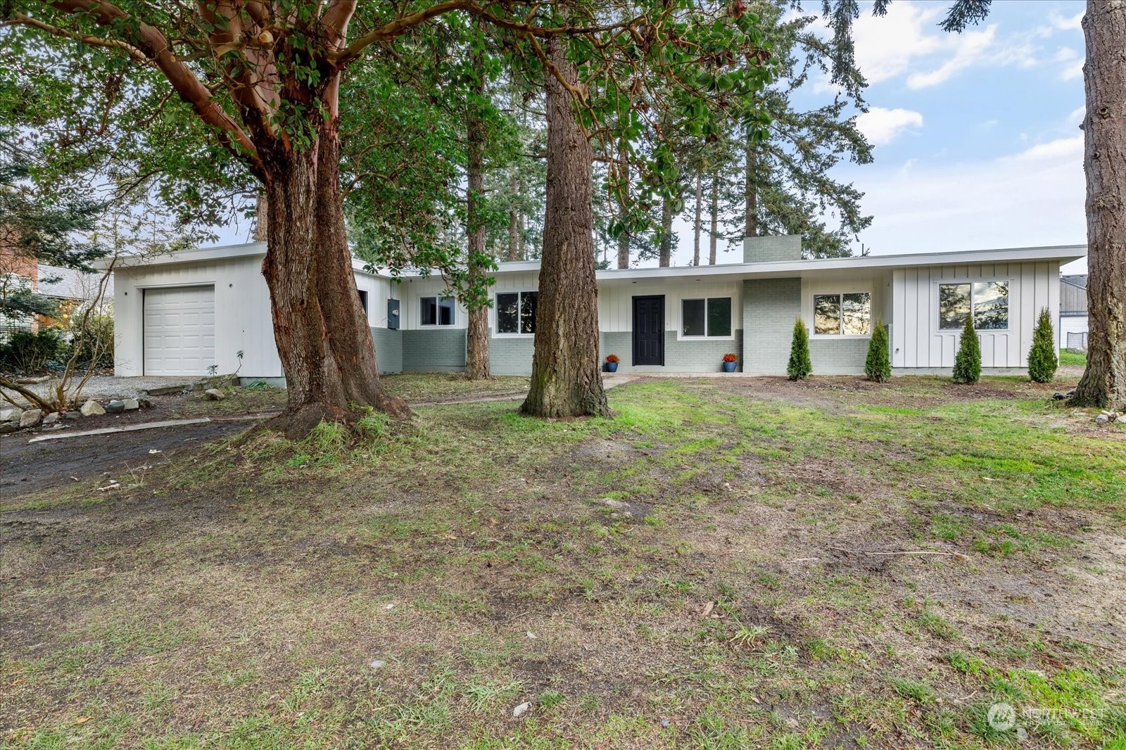 front view of a house with a yard