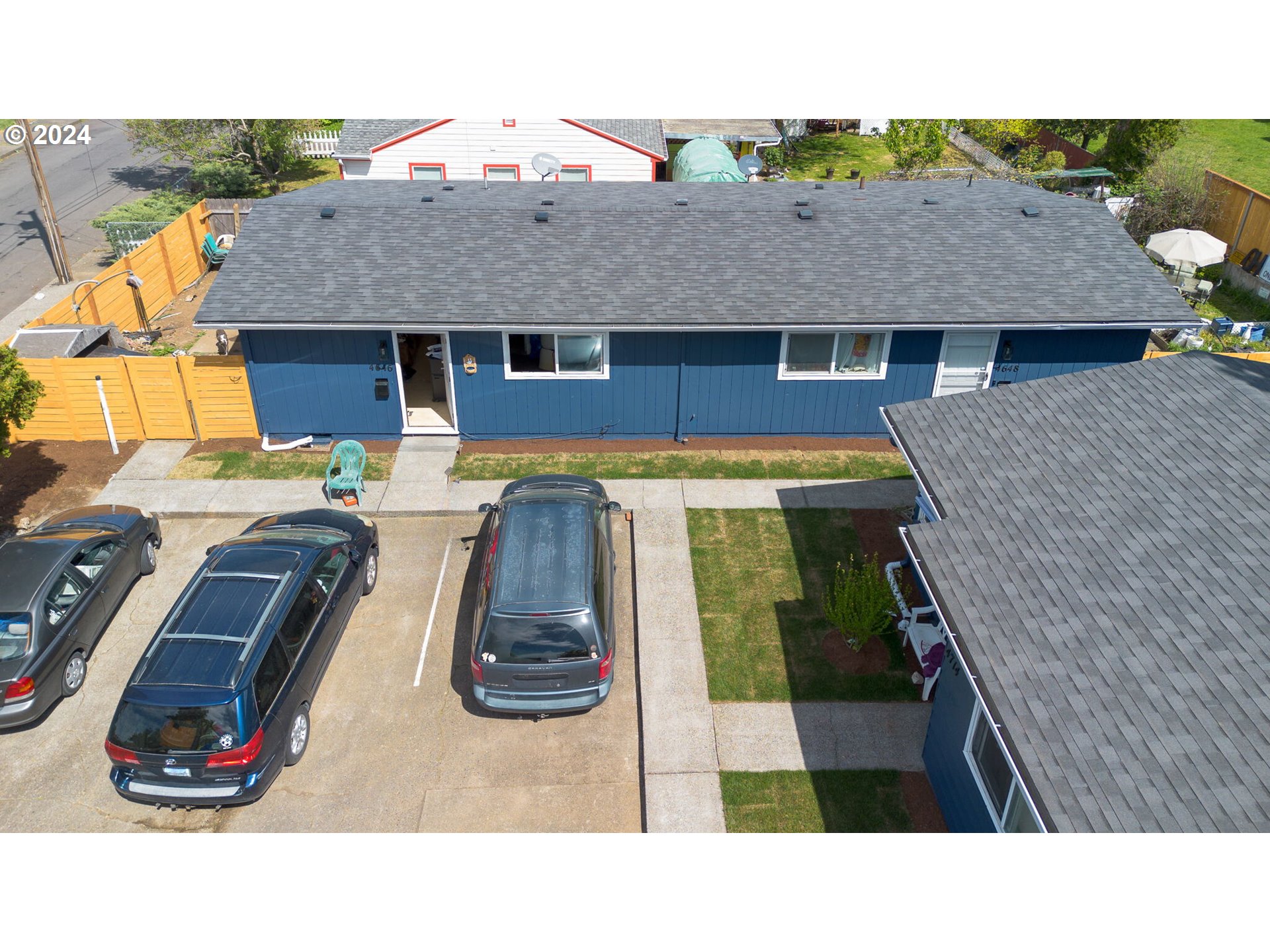 a aerial view of a house with swimming pool and furniture