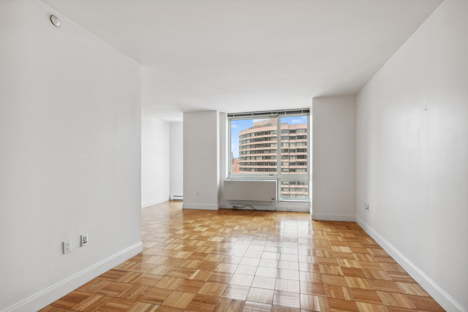 a view of an empty room with a window