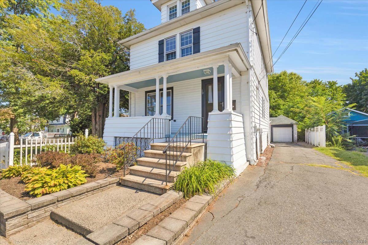 front view of a house with a yard