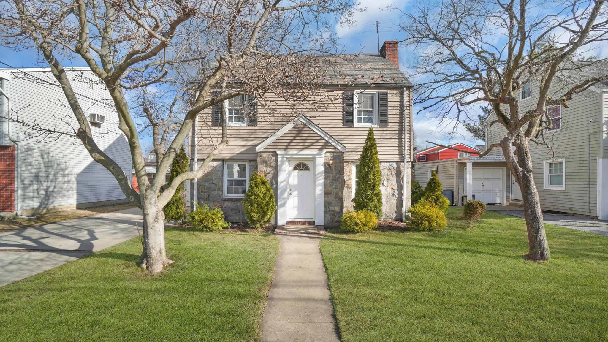 View of front of house with a front lawn