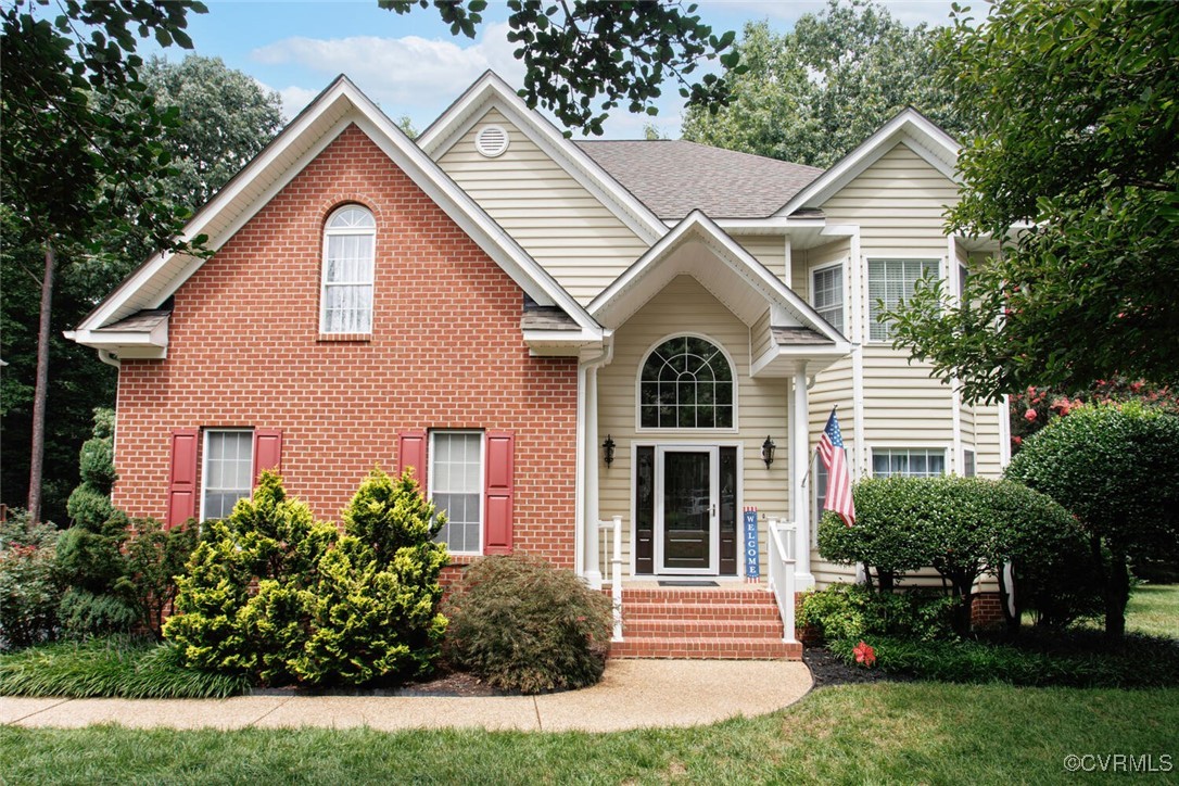 a view of a yard in front view of a house