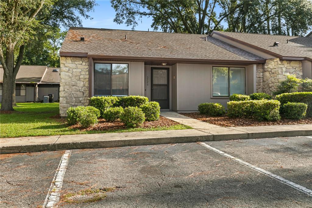 front view of a house with a yard