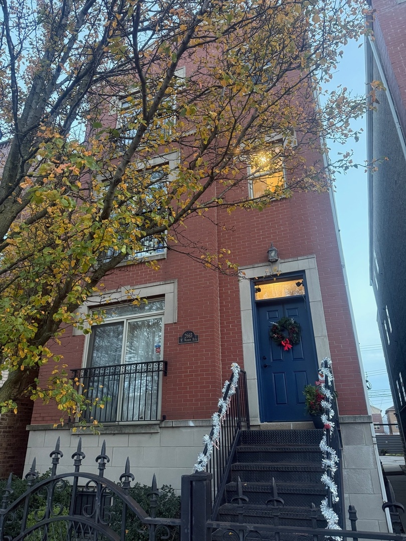 front view of a house with a small yard