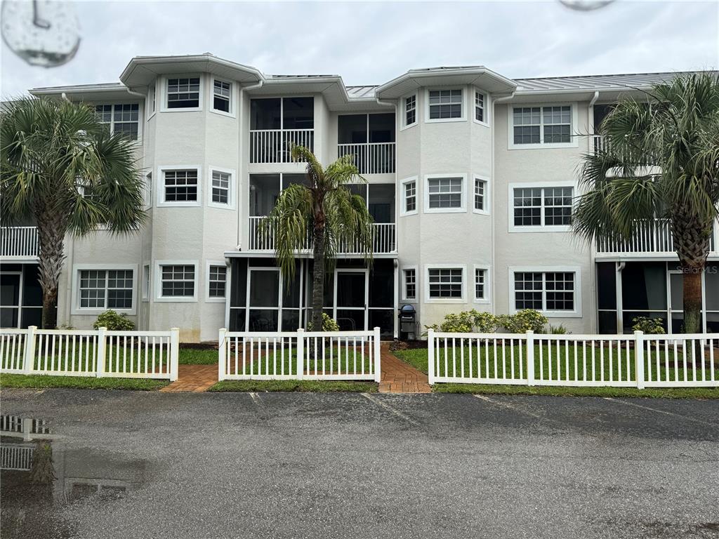 a front view of a house with a fence