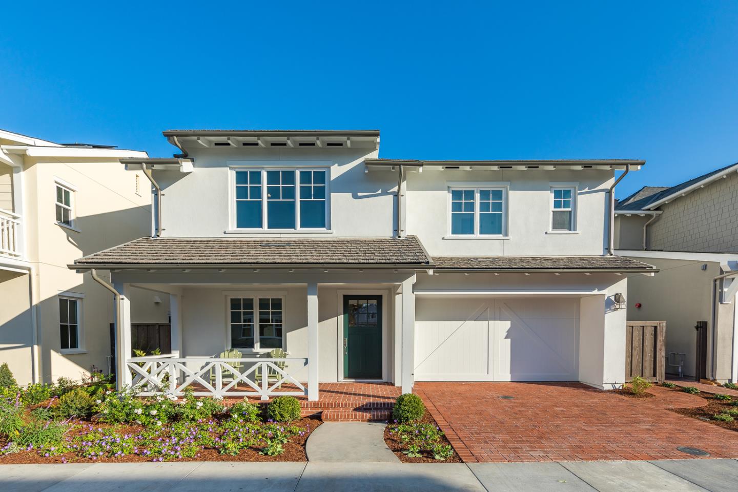 a front view of a house with yard