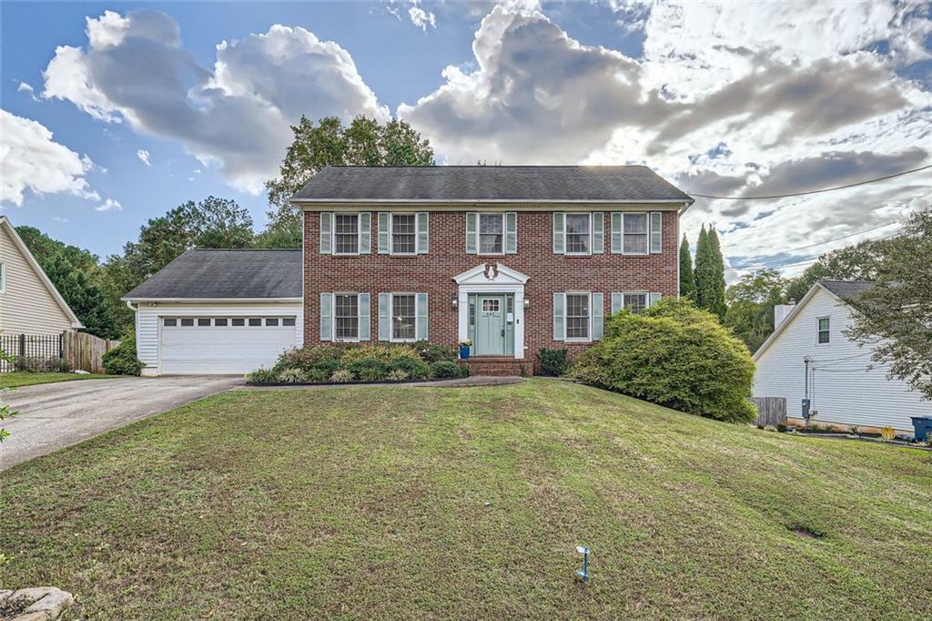 a view of a big yard in front of a house