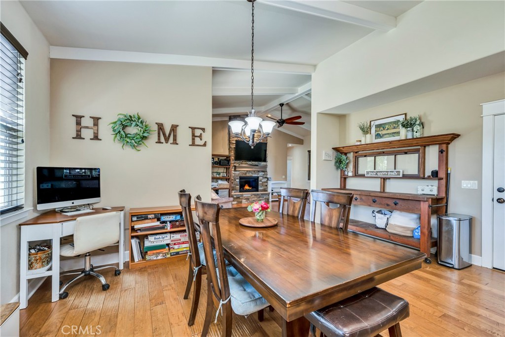 a view of a dining room with furniture and a floor to ceiling window