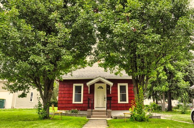 a front view of a house with garden