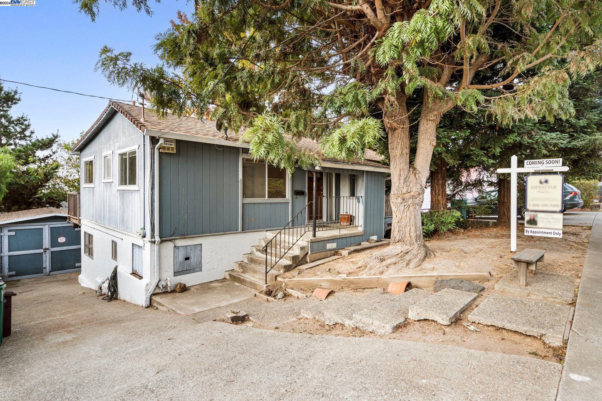 a view of a house with a tree