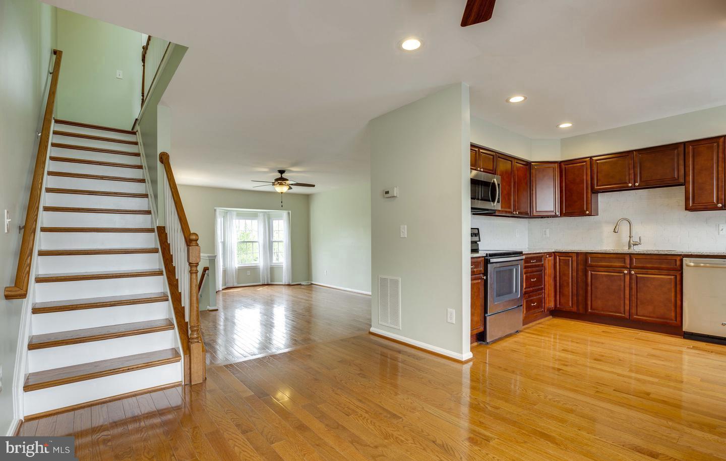 a view of a kitchen with a sink and cabinets