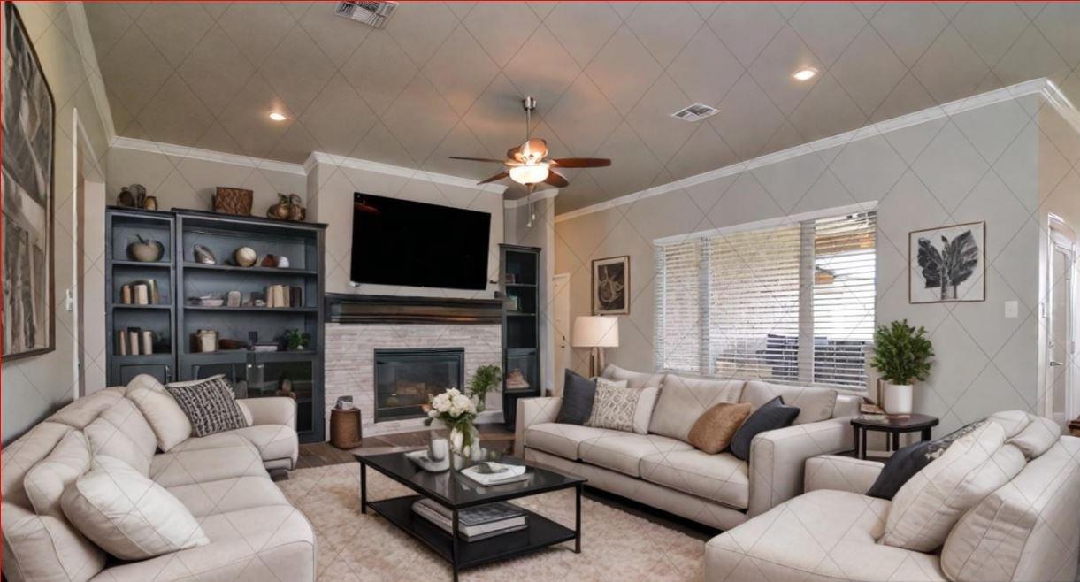 a living room with furniture a fireplace and a flat screen tv