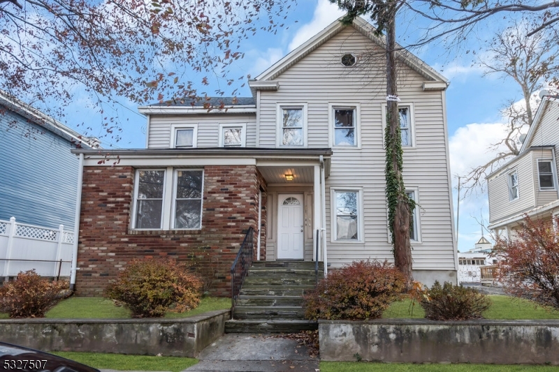 a front view of a house with garage