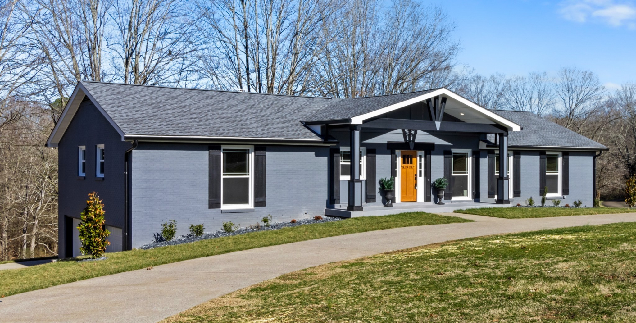 a front view of a house with a yard