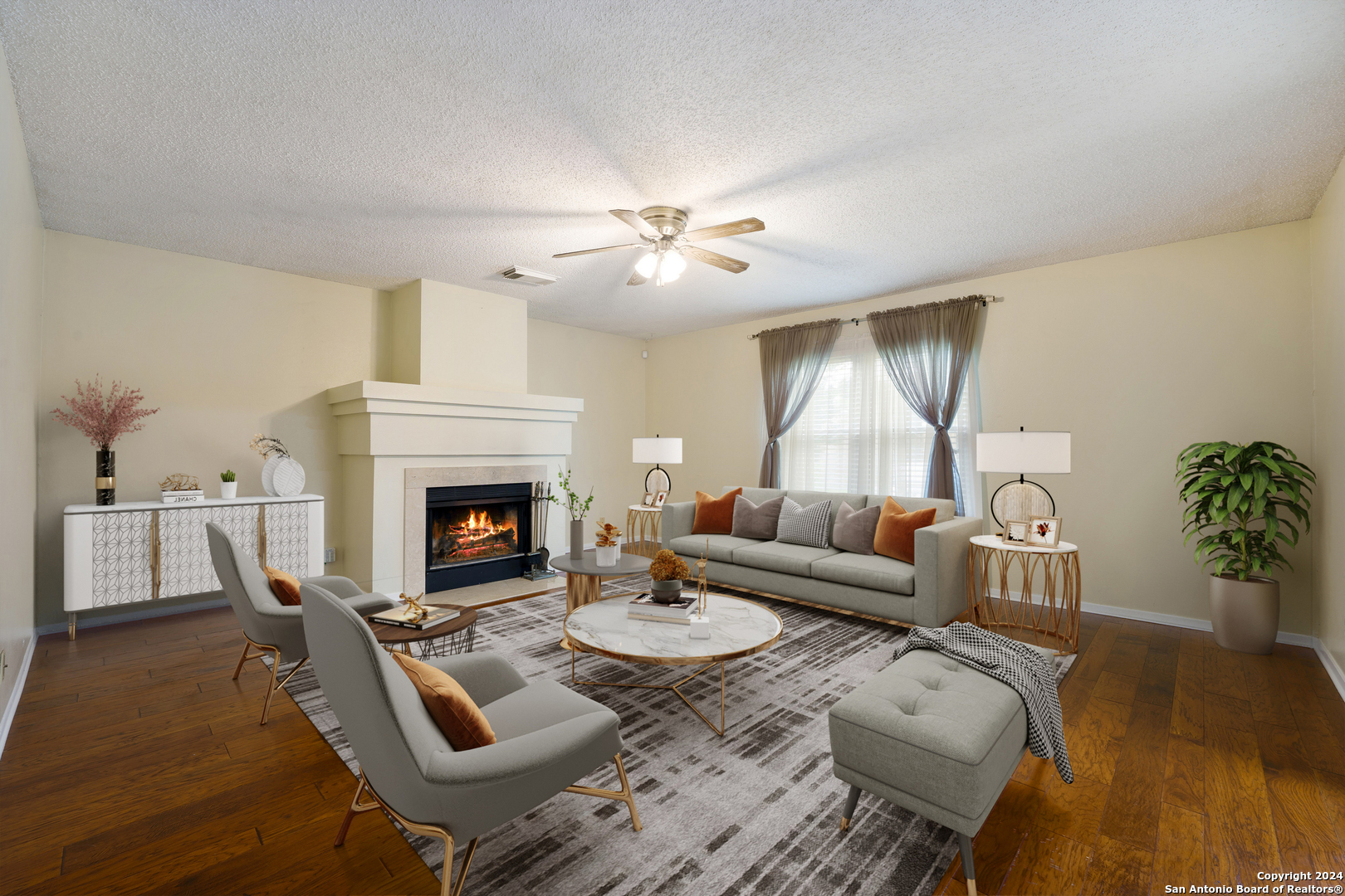 a living room with furniture and a fireplace