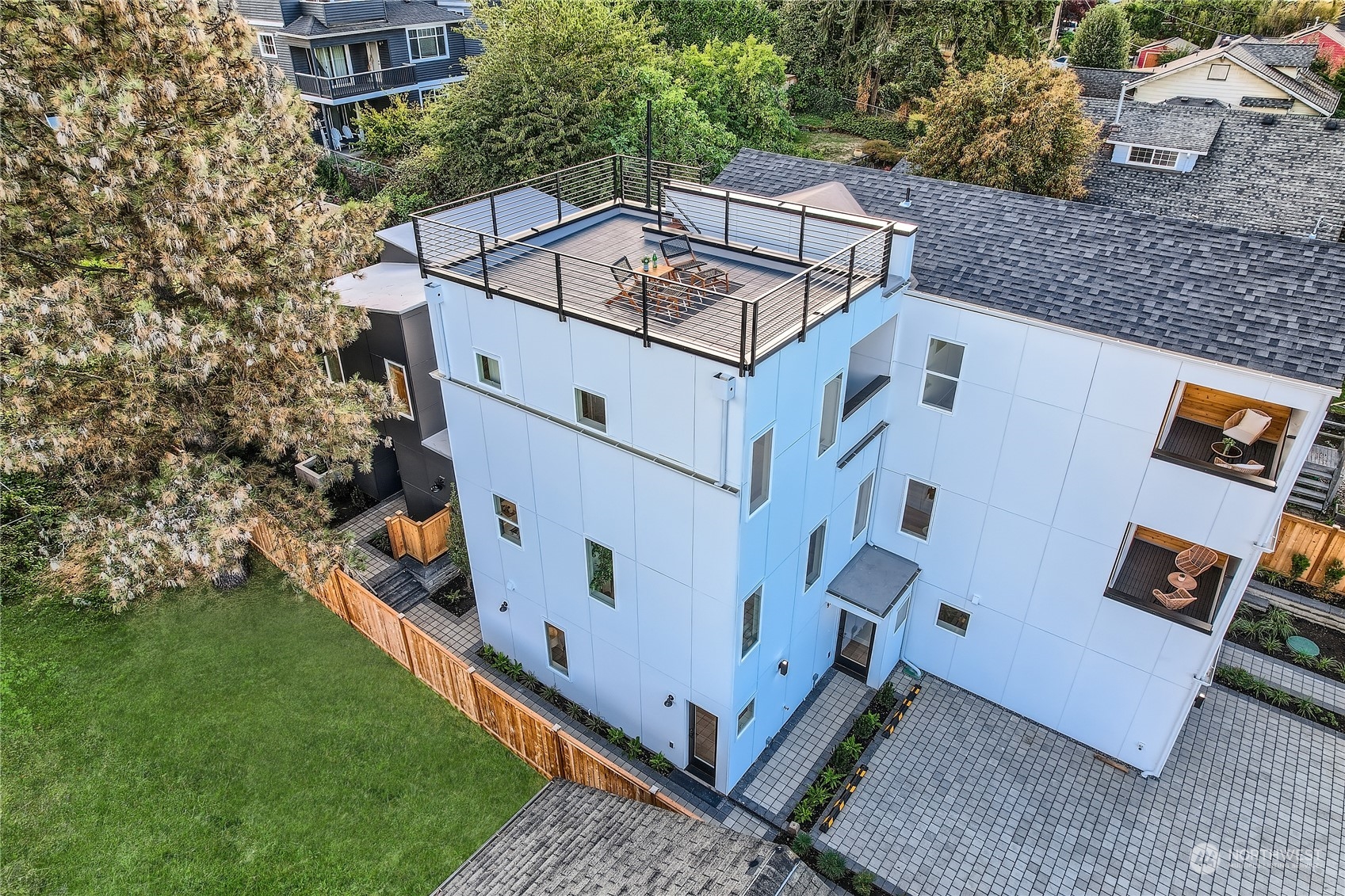 an aerial view of a house with a yard