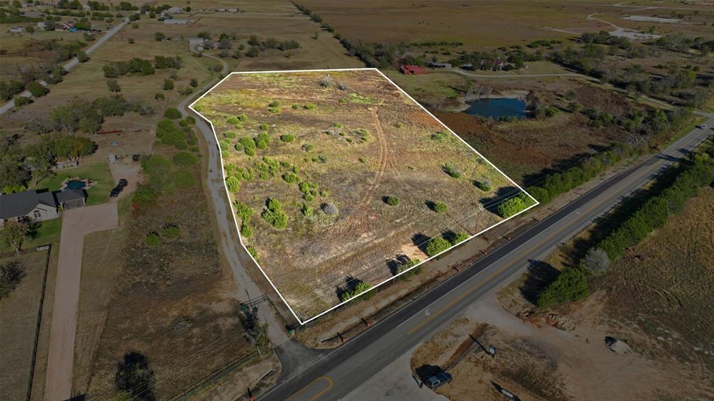 an aerial view of a residential houses with outdoor space