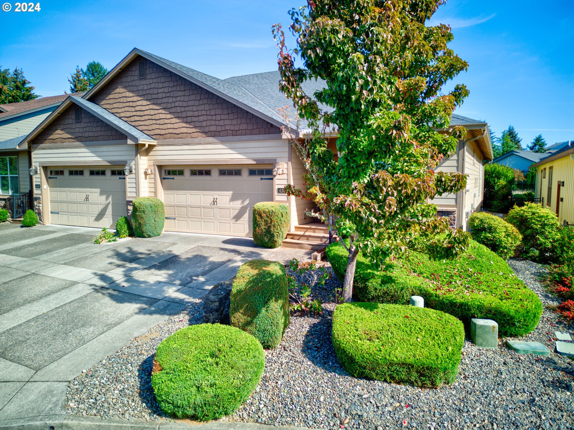 a front view of a house with garden