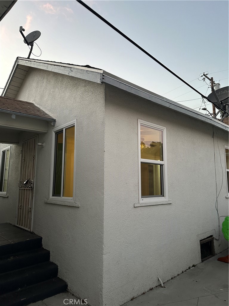 a view of a house with wooden walls