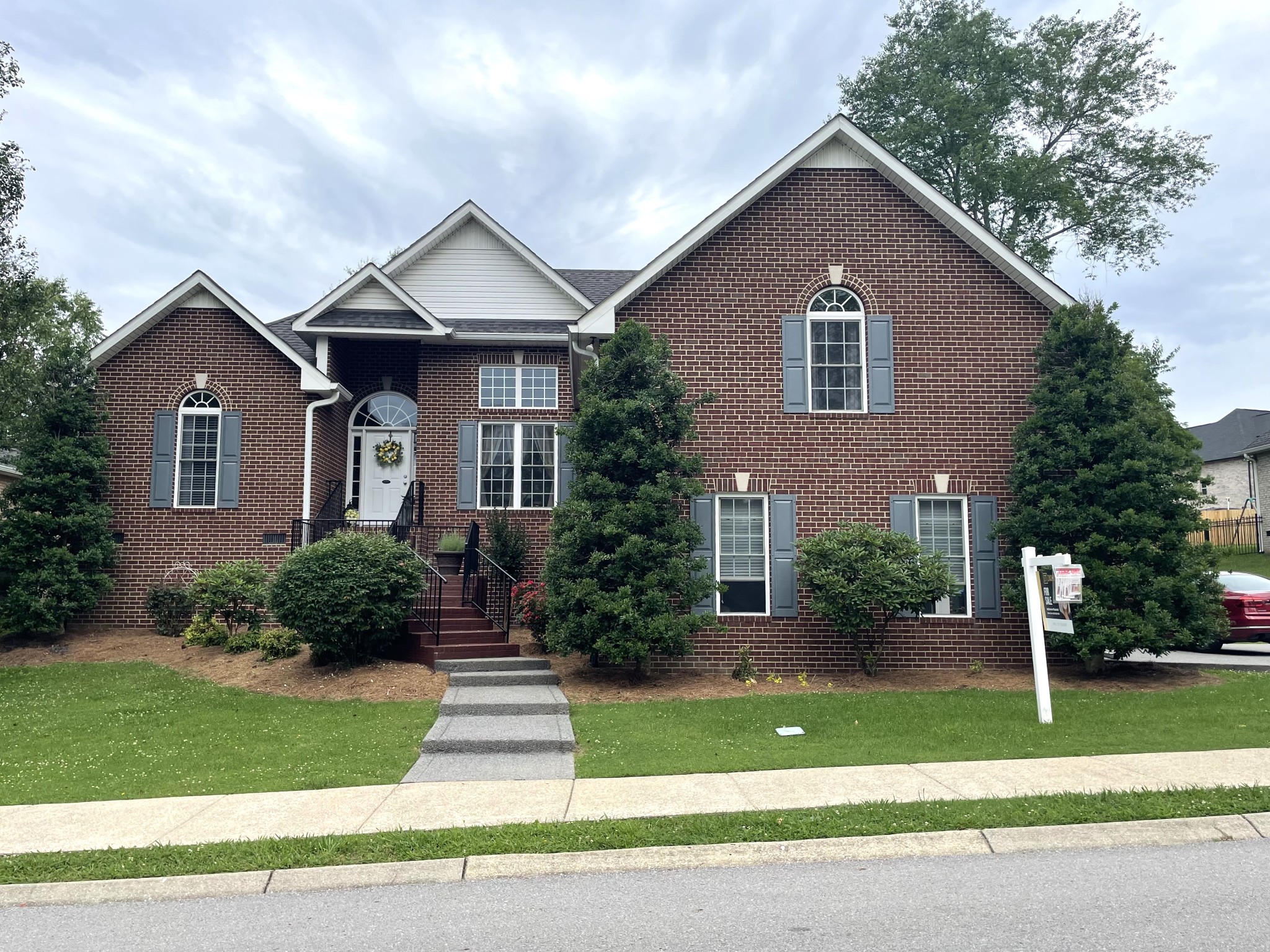 a front view of a house with a yard