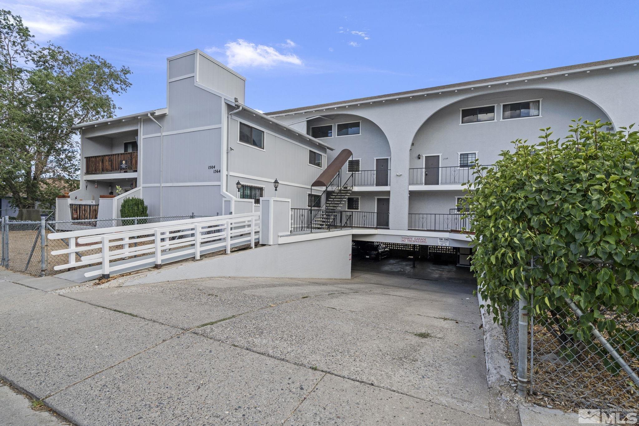 a view of a house with a yard and garage