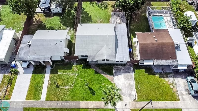 an aerial view of house with yard