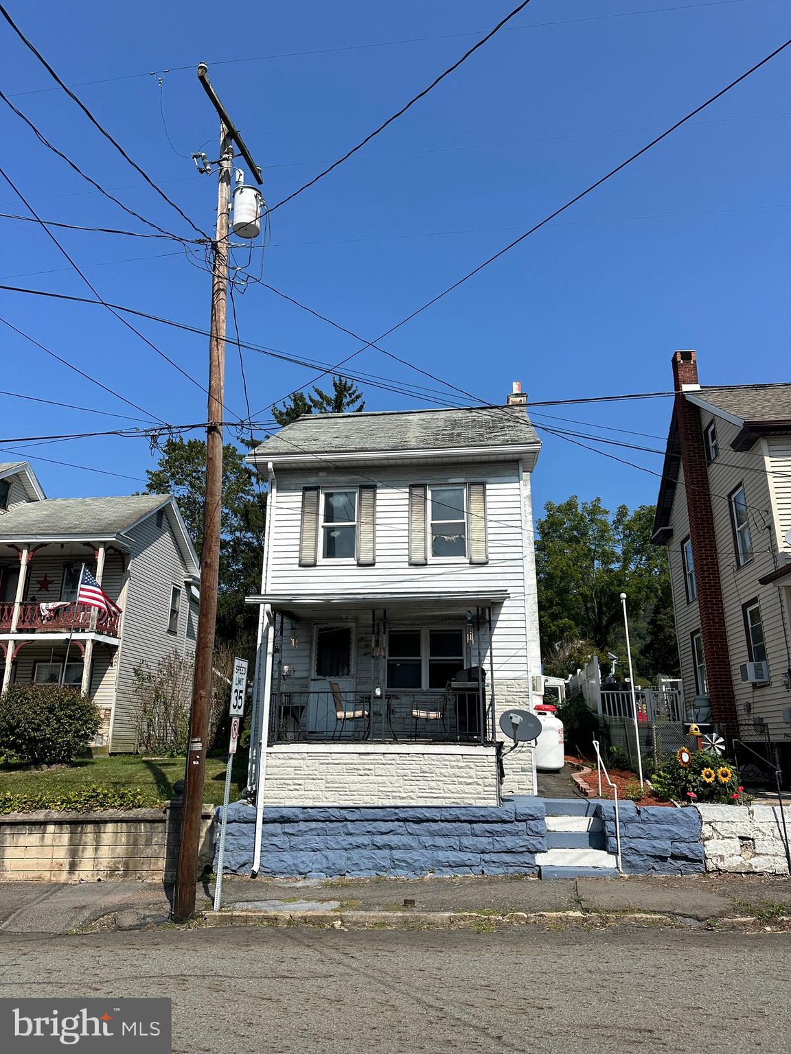 a front view of a house with a porch