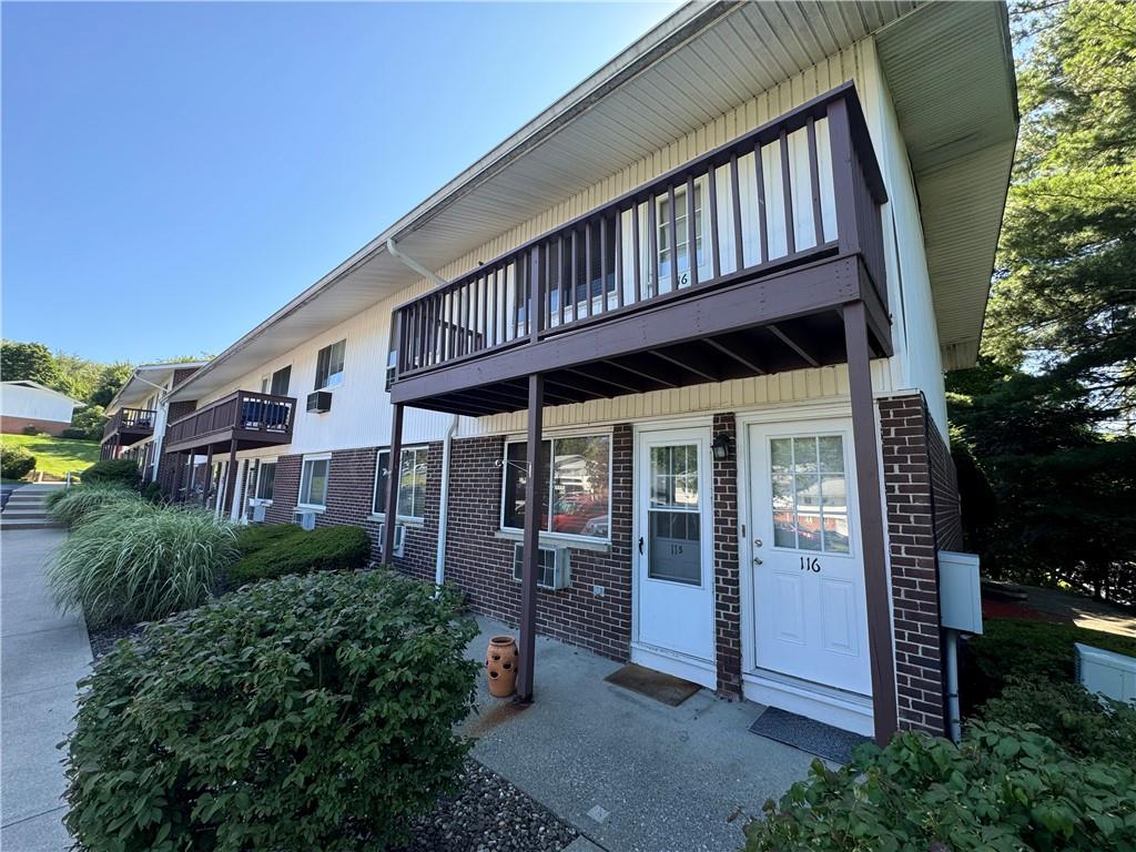 a view of a house with porch and windows