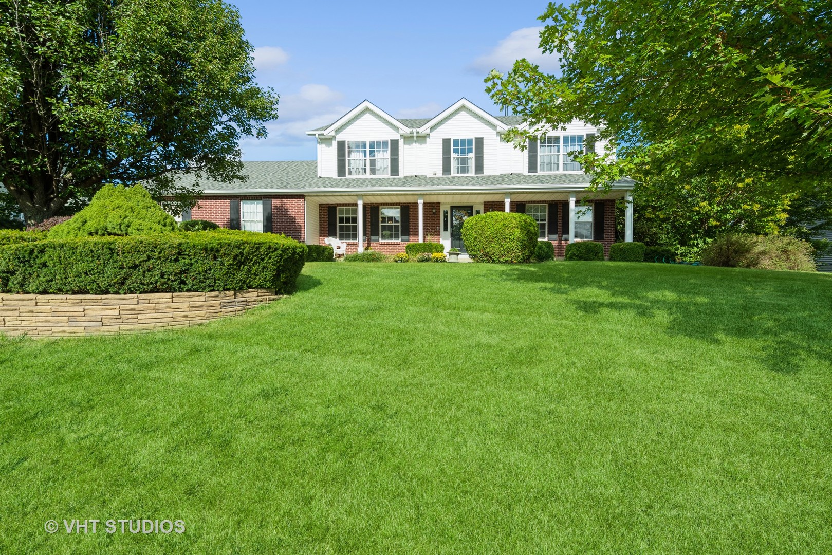 a front of a house with a garden