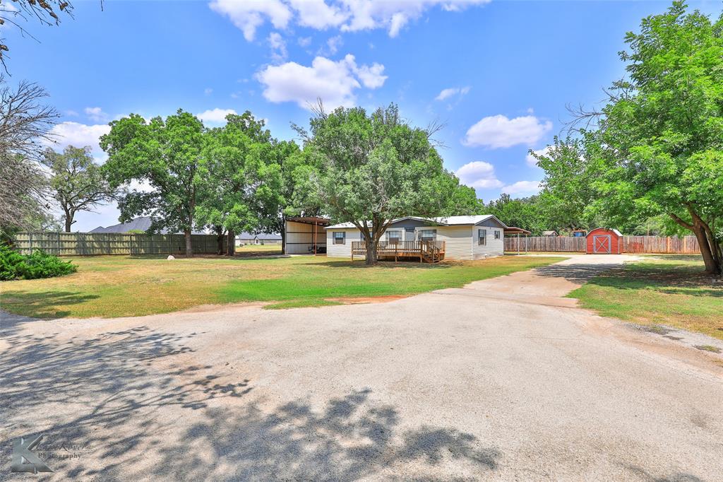 a view of a house with a big yard