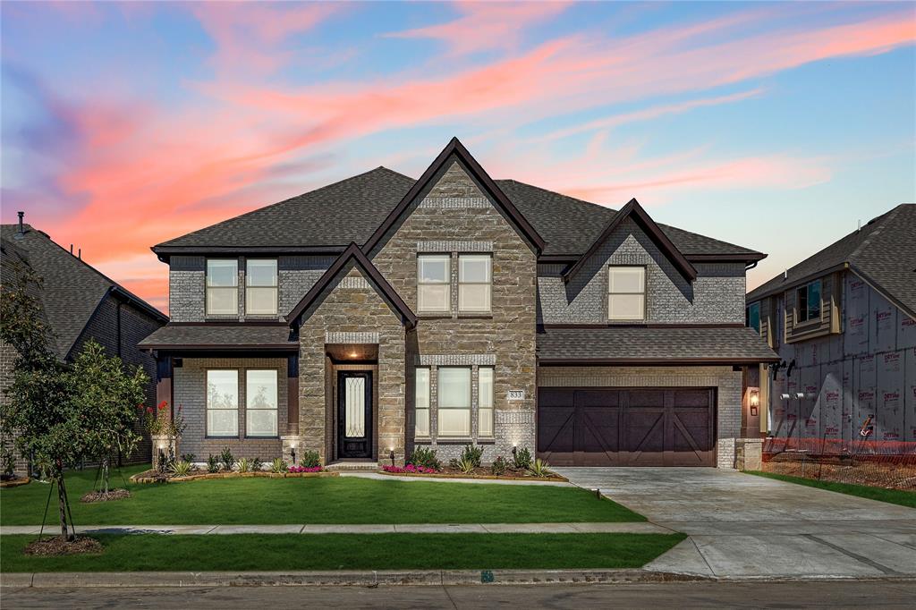 a front view of a house with a yard