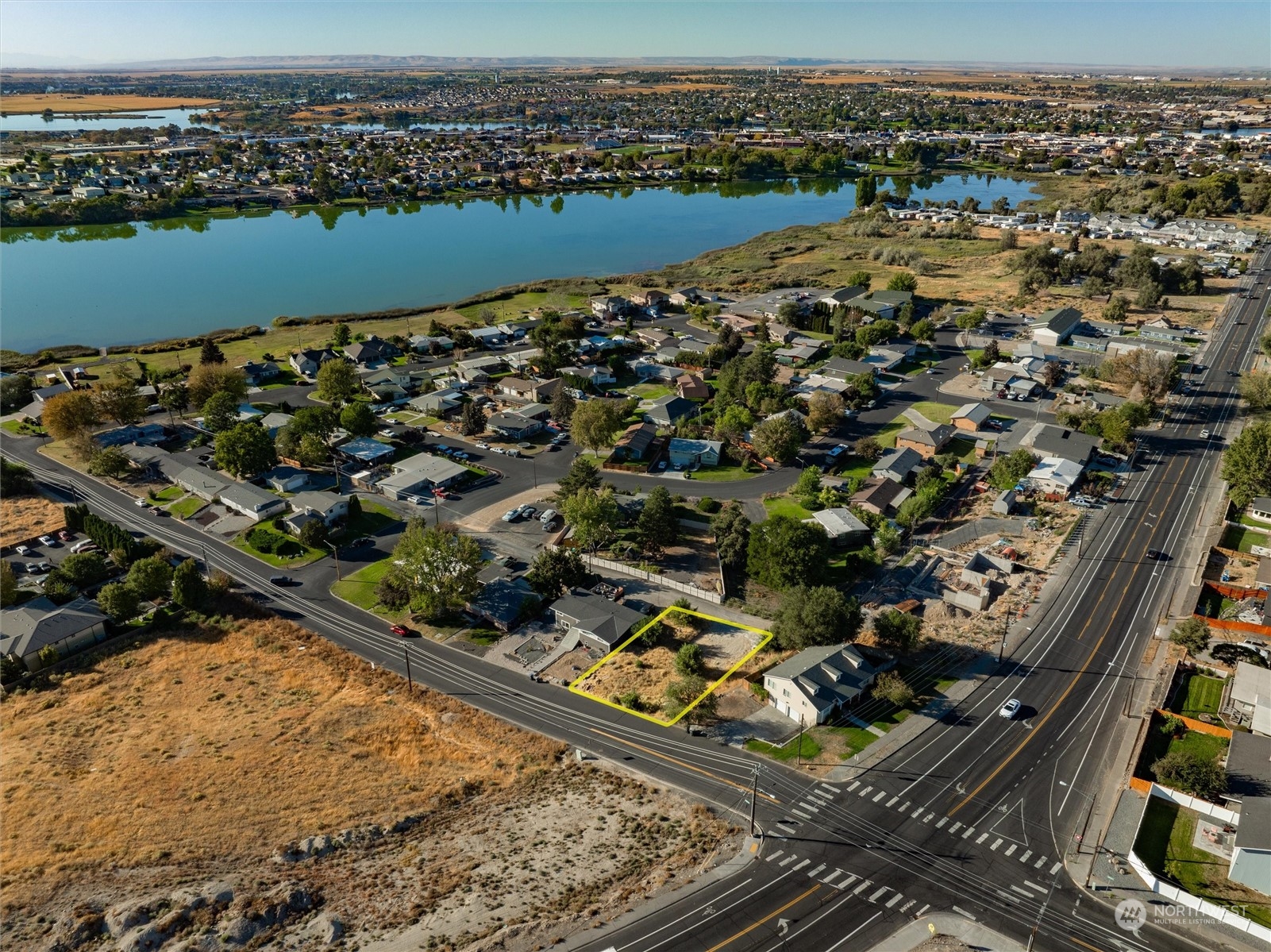 an aerial view of a residential houses with outdoor space