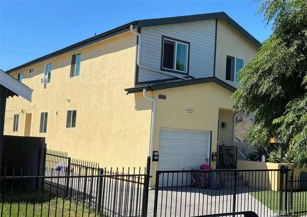 a view of a house with a small yard