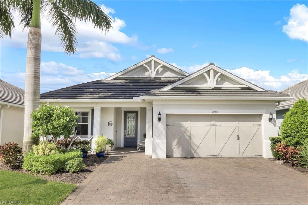 View of front facade featuring a garage