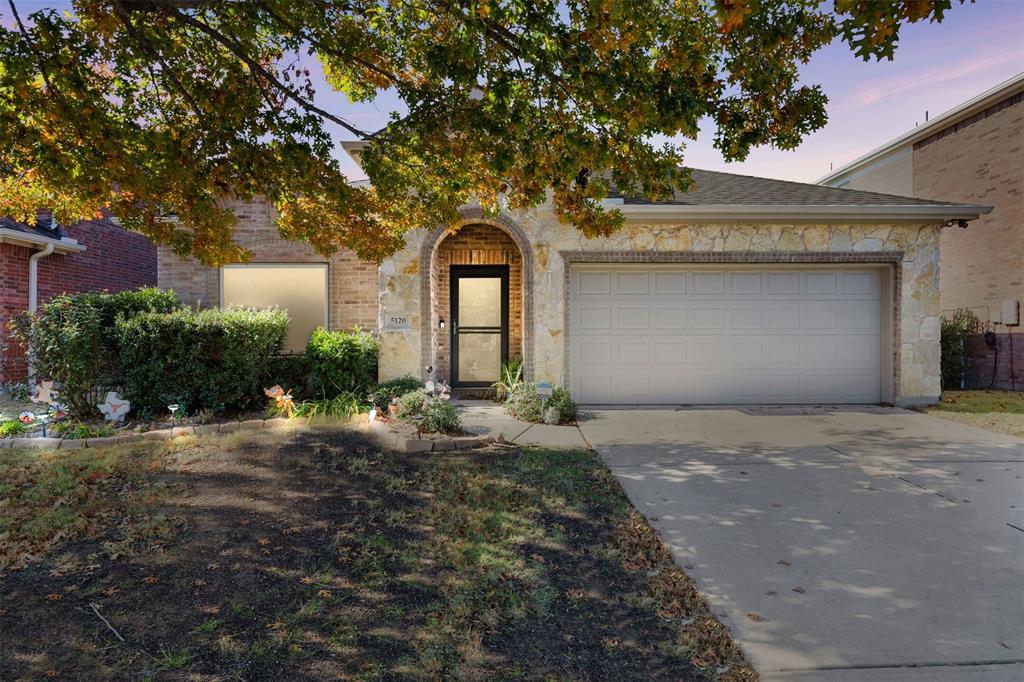 View of front of property with a garage