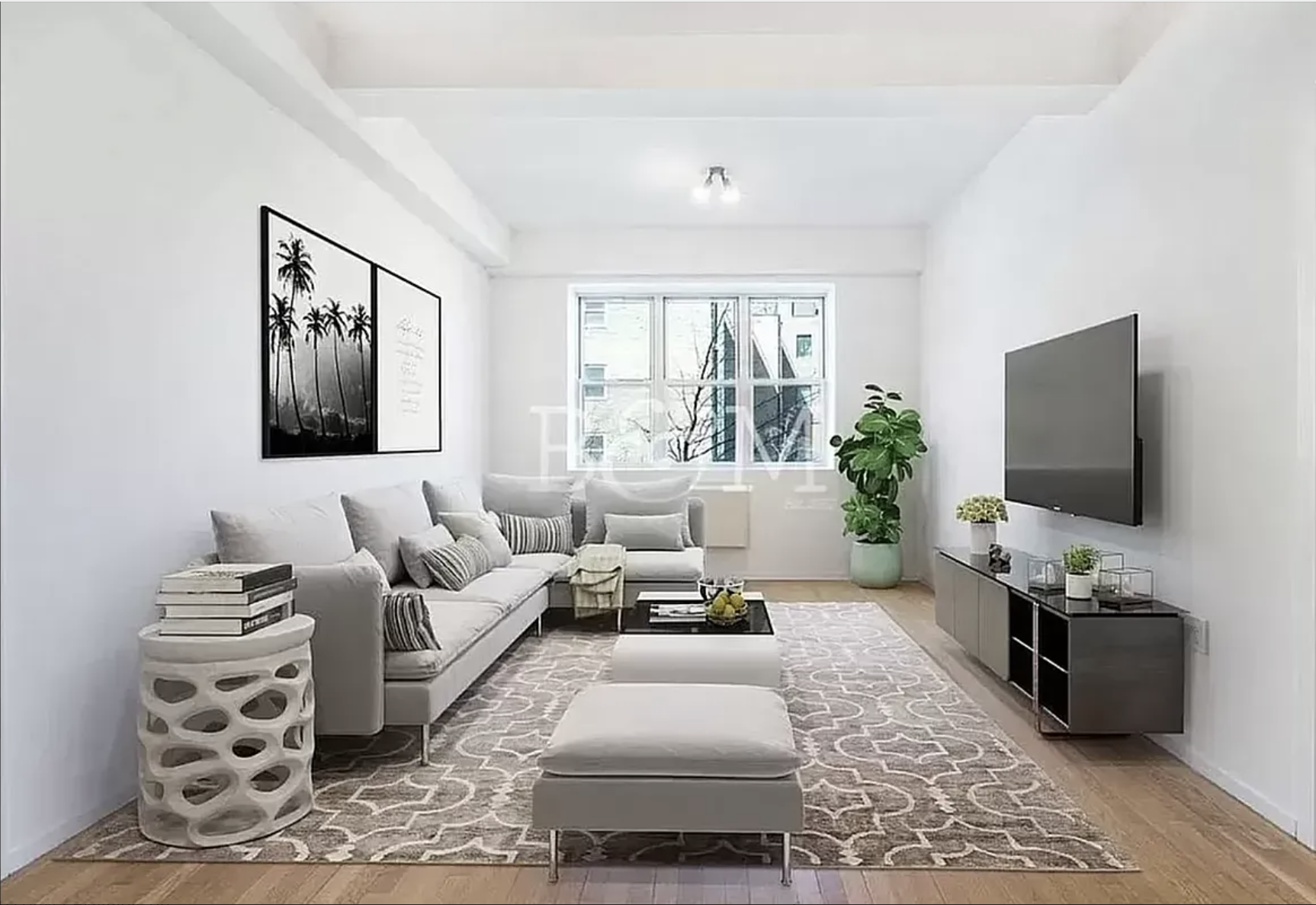 a living room with furniture a flat screen tv and a large window