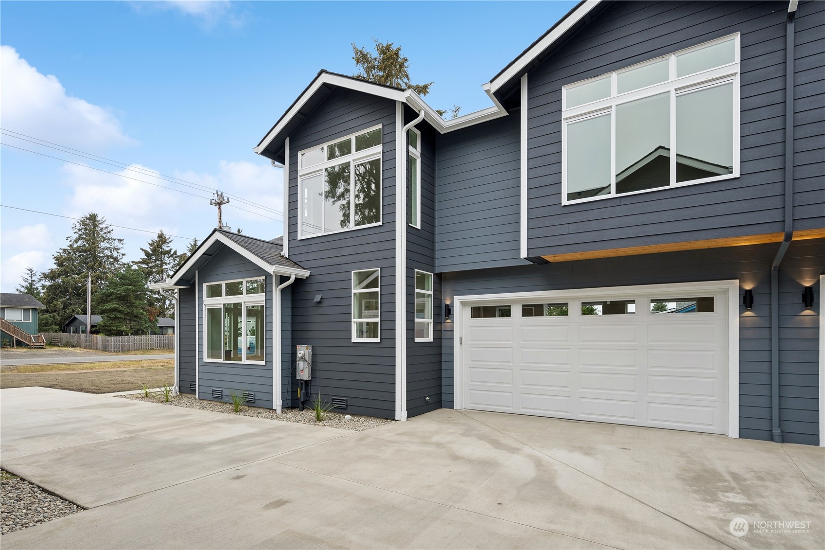 a front view of a house with a garage